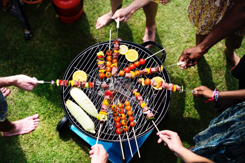 View from above of people grilling skewers